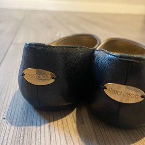 Jimmy Choo Black and Gold Flats